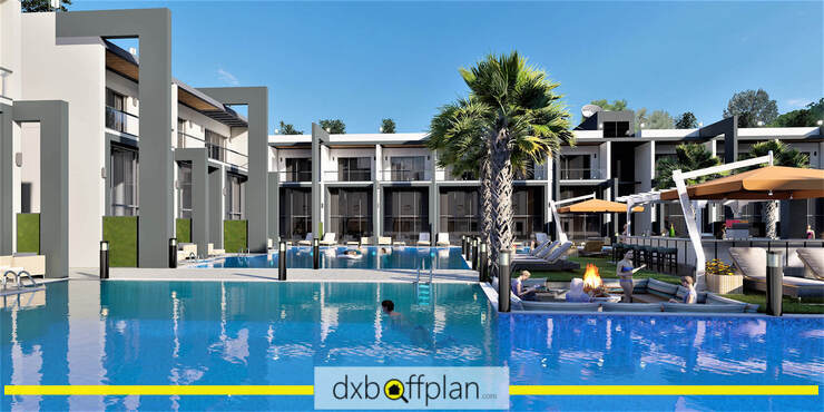 La Joya Residences features a sparkling communal swimming pool with sun loungers.