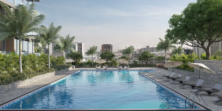 Swimming pool with lush greenery at Skyhills Residences 2, Dubai.