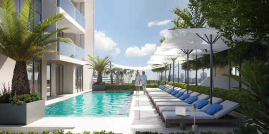 Aurel1a Residences - Swimming Pool: Aerial view of a luxurious pool surrounded by sun loungers.