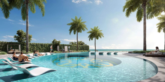 La Mer Apartments: Guests relax by the lush infinity pool.