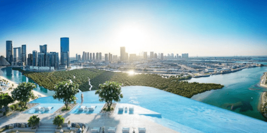 Rivage at Al Reem Island outdoor swimming pool with serene sea views.
