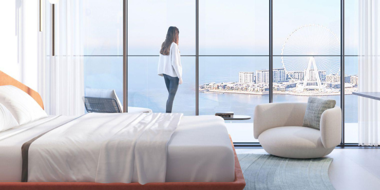 W Residences: Serene bedroom with private balcony access.