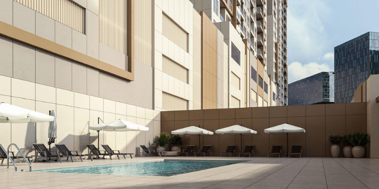 Swimming pool with beach views at Ajman One Phase 2.