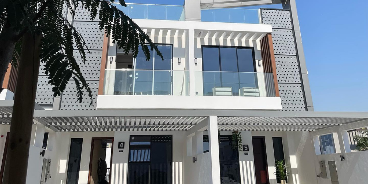 Facade of OAK Townhouses with elegant oak wood accents and contemporary design.