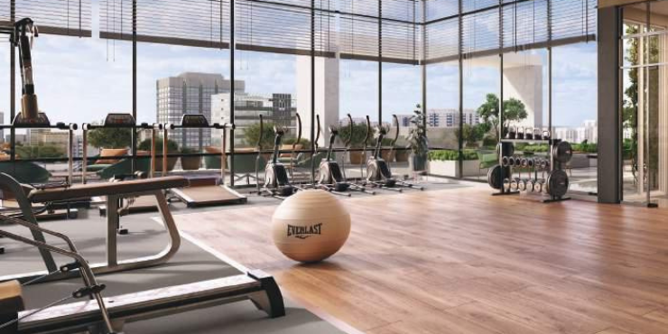 Rooftop fitness studio at Blossom 76 with panoramic city views.