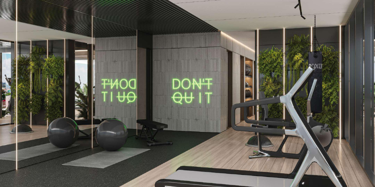 Fully equipped indoor gym at Gharbi II Residences for fitness enthusiasts.