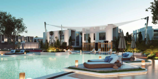 Swimming pool and relaxation area in Mada'in Square’s lush green community.