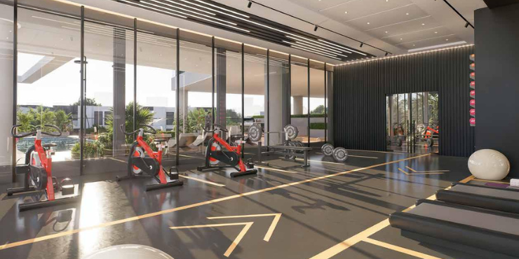 Fully equipped gym at 77 Boulevard, JVC, for residents.